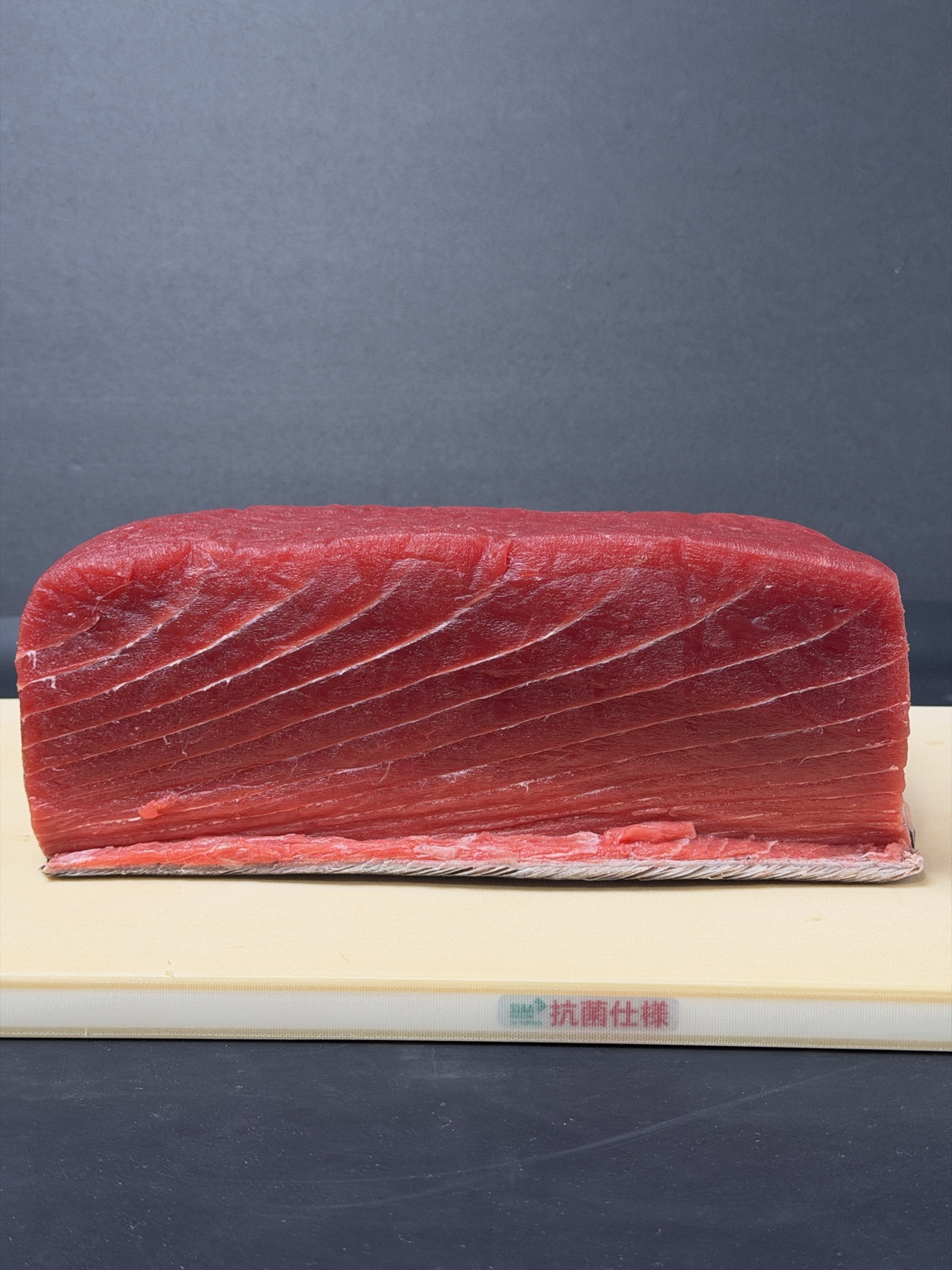 Clean Atlantic bluefin tuna loin displayed on a cutting board